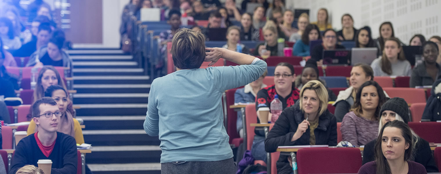 Lecturer speaking to her students